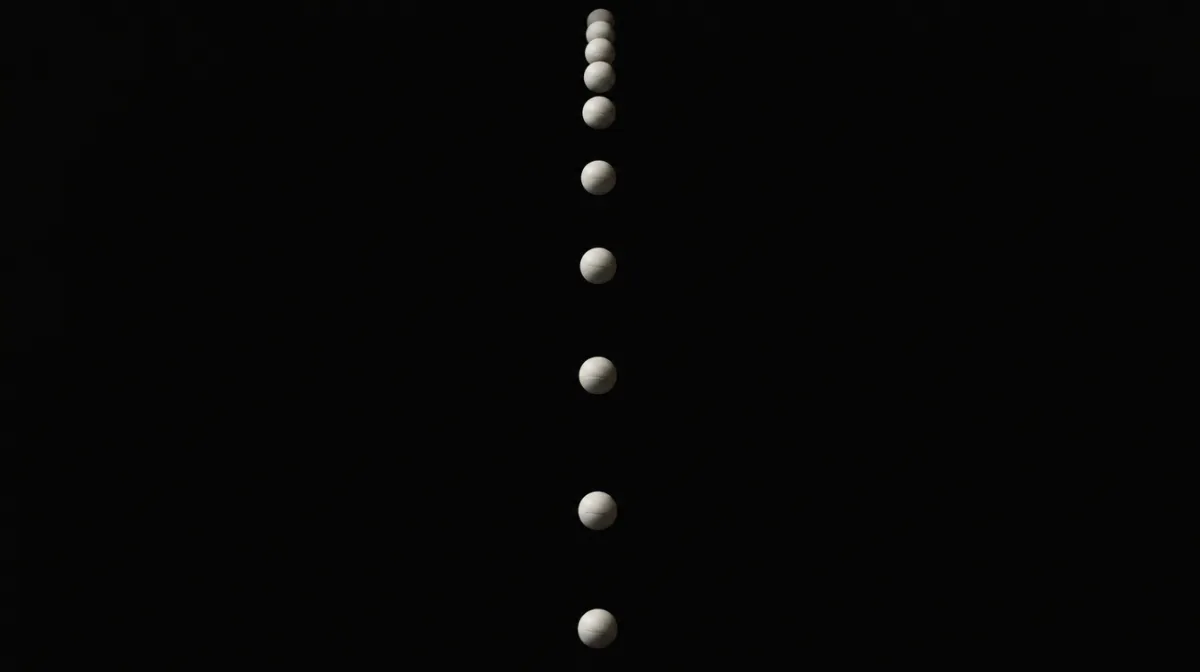A stroboscopic photo of a falling ball with evenly spaced frozen positions